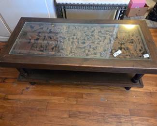 #11	Carved Asian Village under glass Coffee Table (not real wood and needs tightening) - 44x19.5x19	 $125.00 

