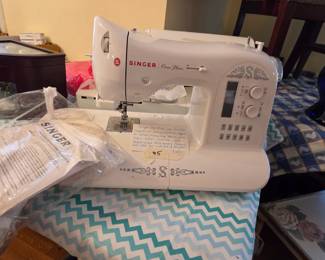 #5	Singer One Plus user friendly Computerized Sewing Machine (approx 281) Designs built in 	 $150.00 
