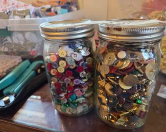 #89	two jars of random buttons	 $20.00 
