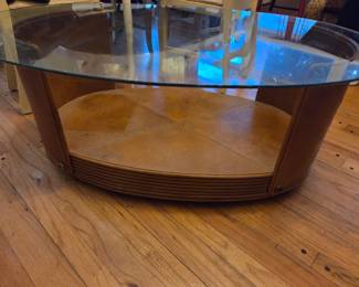 #39	Glass Top Oval Coffee Table w/Leather Sides and Bottom Shelf  on wheels  29.5x46x18	 $75.00 
