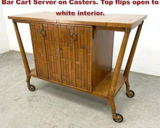 Lot 262 Bert England Mid Century Modern Bar Cart Server on Casters. Top flips open to white interior. 