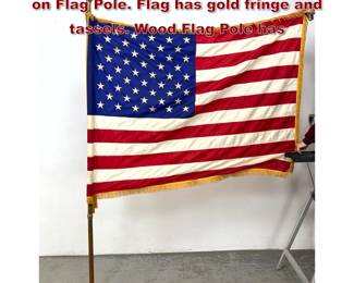 Lot 489 50 Star Ceremonial American Flag on Flag Pole. Flag has gold fringe and tassels. Wood Flag Pole has 