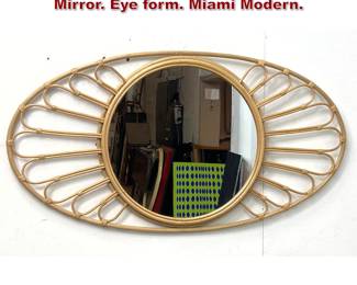 Lot 543 Modernist Rattan Oval Framed Wall Mirror. Eye form. Miami Modern. 