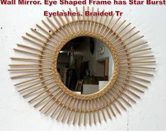 Lot 541 Natural Rattan and Wicker Eyelash Wall Mirror. Eye Shaped Frame has Star Burst Eyelashes. Braided Tr