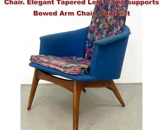 Lot 299 Mid Century Modern Walnut Lounge Chair. Elegant Tapered Leg Frame supports Bowed Arm Chair. Contrast