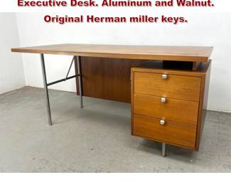 Lot 128 George Nelson for Herman Miller Executive Desk. Aluminum and Walnut. Original Herman miller keys. 