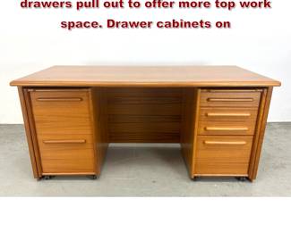 Lot 435 MCM Danish Teak Desk. Both sets of drawers pull out to offer more top work space. Drawer cabinets on