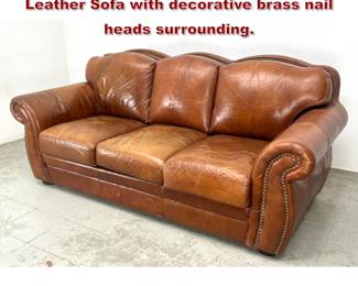 Lot 889 Robertson and Robertson Distressed Leather Sofa with decorative brass nail heads surrounding.