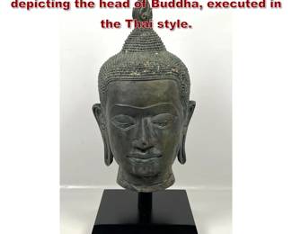 Lot 653 Asian cast bronze sculpture depicting the head of Buddha, executed in the Thai style.