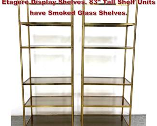 Lot 626 Pr Regency style Brass Tone Etagere Display Shelves. 83 Tall Shelf Units have Smoked Glass Shelves.