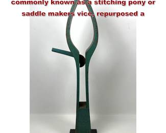 Lot 701 A tall, antique wooden clamp, commonly known as a stitching pony or saddle makers vice, repurposed a