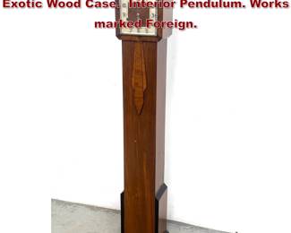 Lot 1643 Art Deco Fllor Clock Chimes. Exotic Wood Case. Interior Pendulum. Works marked Foreign.