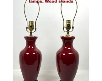 Lot 1433 Pr. Sang De Bouef porcelain table lamps. Wood stands