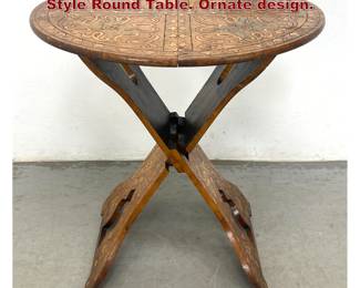 Lot 1629 AngloIndian Folding Pyrography Style Round Table. Ornate design.