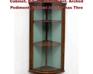 Lot 1623 Antique Walnut Hanging Corner Cabinet. Bowed Glass Front. Arched Pediment. Painted Interior has Thre