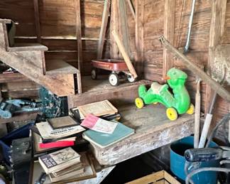 Child's Red Metal Wagon and Green Ride-On Toy