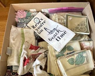 Assorted Linens and Textiles with Coastal and Floral Motifs