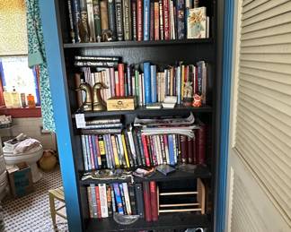 Black IKEA Billy Bookcase with Assorted Books and Shoes