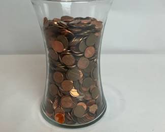 Vase Full Of A Variety Of Years In Pennies