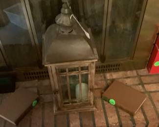 Lantern on mantel.