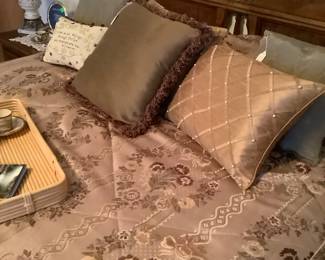 The other Queen size bed with beautiful comforter and decorative pillows.