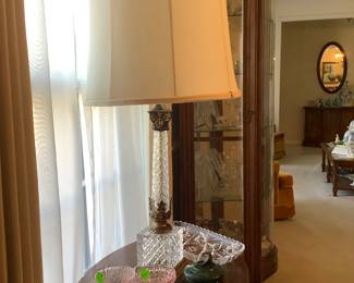 The oval Antique table in dining room with bottom shelf. So unusual.