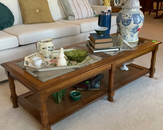 The Midcentury coffee table with glass inserts and bottom shelf.