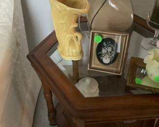 Close-up of items on end table, one of McCall and one of Fenton.