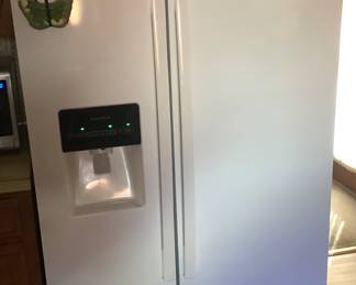 The Refrigerator/freezer combination. Has an ice maker, water dispenser. In excellent condition.