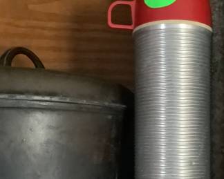 The two greatest things in the kitchen. A old thermos and a large cast iron pot with cast iron lid. Great for cooking camp stew or turnips.