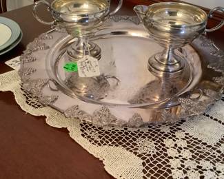 The silver items on buffet.