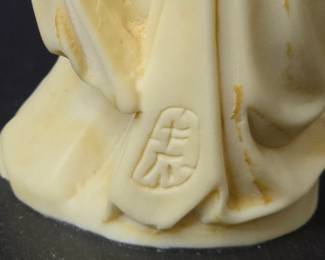 Faux Carved Ivory Figurine of a Woman with Flowers