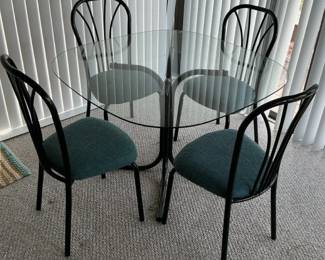 5 Piece Dining Set with Round Glass Table and Black Chairs