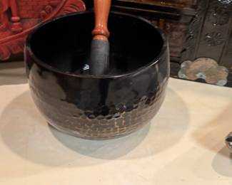 traditional black Japanese singing bowl, known as a rin gong, often used in Buddhist rituals, meditation, and sound healing. 