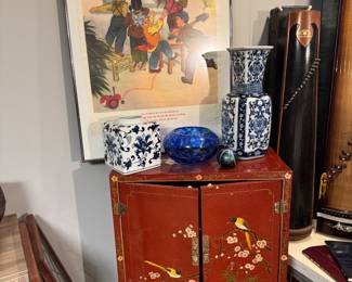 Framed Chinese Cultural Revolution Propaganda Poster
	•	Chinese Blue & White Porcelain Baluster Vase
	•	Chinese Blue & White Porcelain Square Jar
	•	Blue Art Glass Bowl
	•	Decorative Art Glass Orb / Paperweight
	•	Chinese Red Lacquer Cabinet with Hand-Painted Bird and Blossom Motif
	•	Chinese Zither Instrument in Case (Guzheng / Guqin)