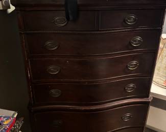 it is a Federal Style mahogany chest on chest featuring a serpentine front and brass hardware