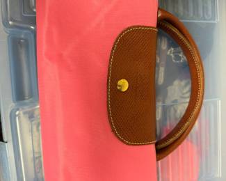 pink Longchamp Le Pliage Original handbag with brown leather trim. 