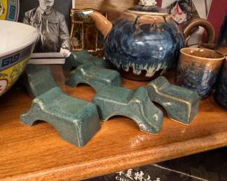 ceramic pot feet, which are designed to elevate planters to improve drainage and prevent damage to decks or patios