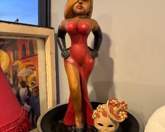 collectible chalkware figurine, likely inspired by the character Betty Boop, given the red dress, blonde hair, and pose