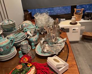 The mask in the foreground (not the turquoise china):
