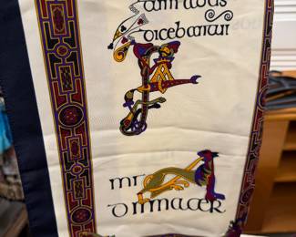Irish Celtic scarf featuring traditional Gaelic script and medieval illuminated manuscript-inspired artwork.