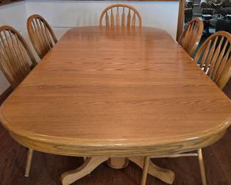 60 inch oval oak table, plus 2 18 inch leaves