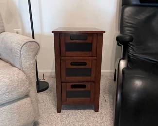 Three-Drawer Wood Nightstand with Black Accents and Cutout Handles