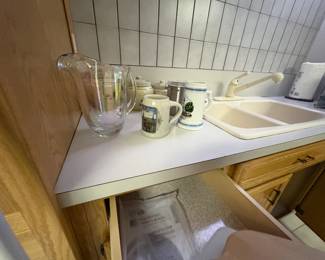 . . . glass pitcher and beer mugs