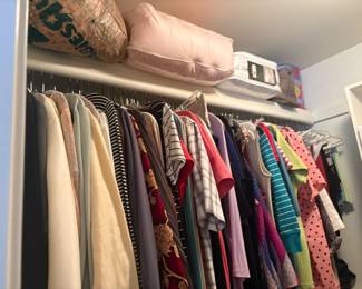 . . . more women's clothing -- notice new linens on top shelf