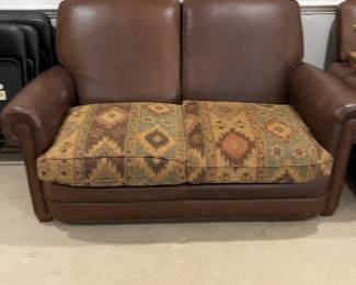 Classic Brown Leather Loveseat with Patterned Fabric Cushions