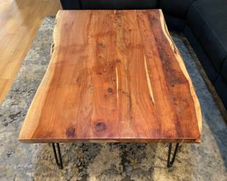 Live edge wood coffee table with black hairpin legs
