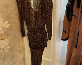 FABULOUS Clothing Collection Featuring Many Vintage Pieces From The 1980s Like.....Western Wear, Velvet Smoking Jackets, Corduroy Pants, Colorful Pant Suits, Snakeskin Sweaters, Rhinestoned & Bedazzled Blazers, Bell Bottom Dresses, & MORE! 