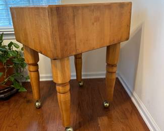 H6 - $400. Butcher Block Table with wheels. Was used in the kitchen for plants and has 2 spots of water damage - see photos. Measures 24" square x 33.5" tall.
