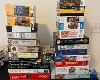 L8 - $40 Puzzles for a year! 25 Puzzles from 500 - 2000 pieces. Most are 1000 pieces. Take ALL for $40.